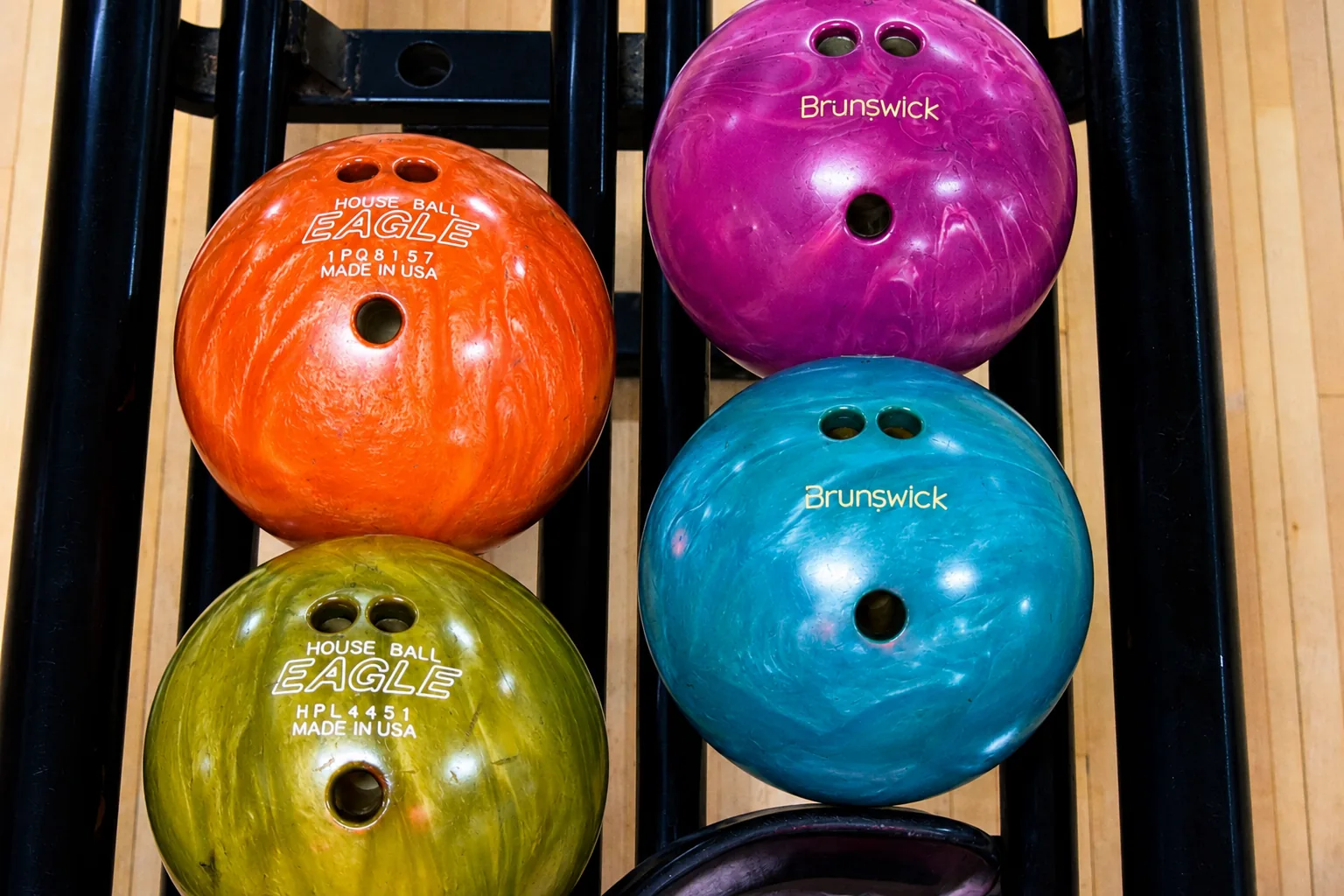 Colorful house bowling balls at Eastern Shore Lanes